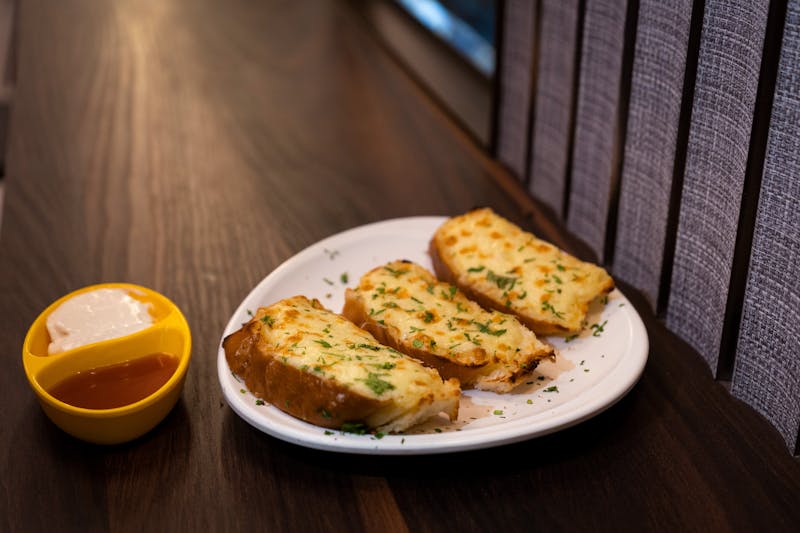 Freshly baked garlic bread with herbs and butter
