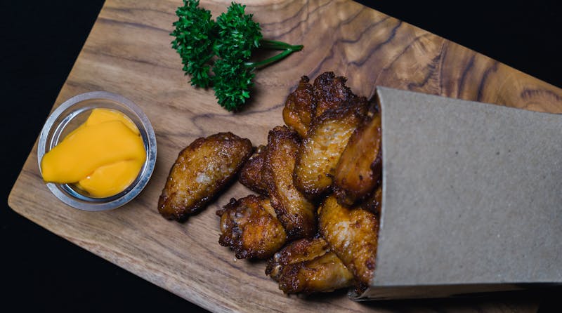Crispy buffalo wings with blue cheese dipping sauce